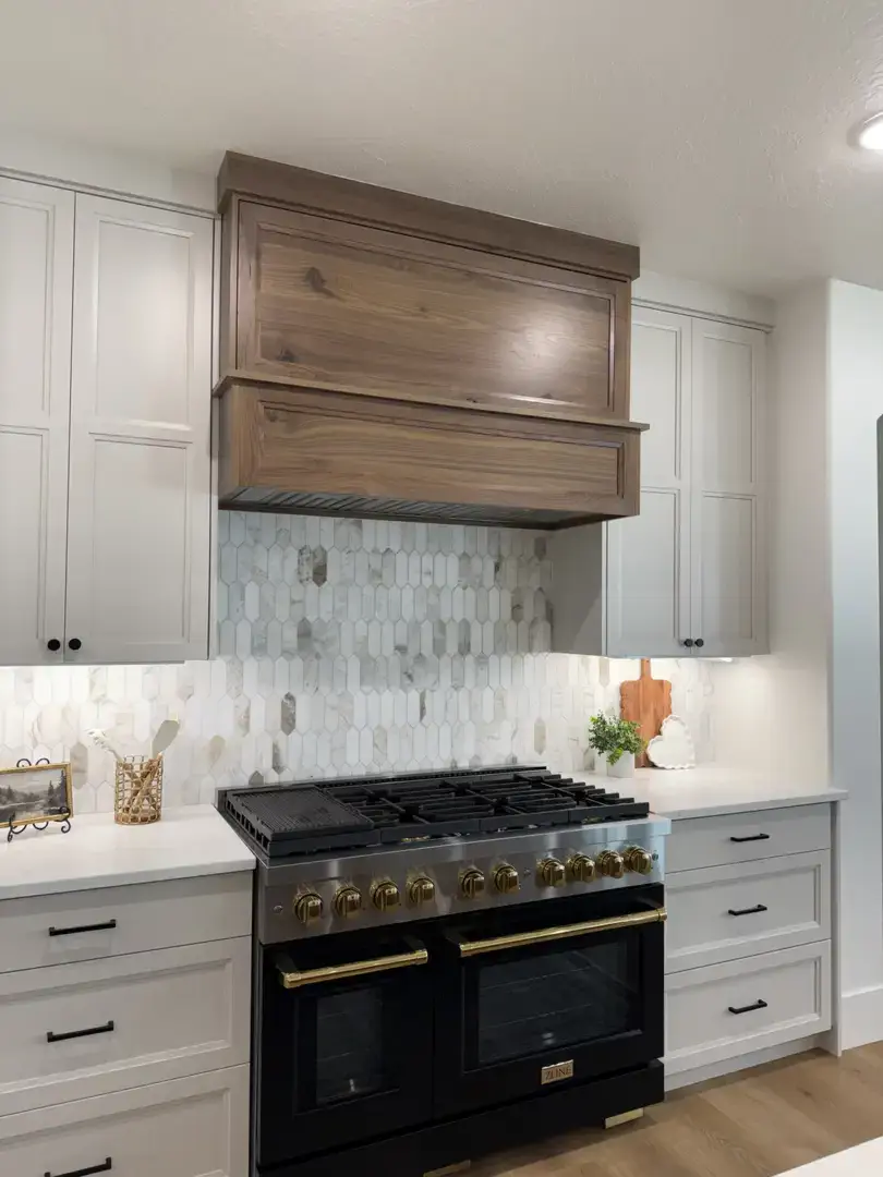 The Olsen Project kitchen in Slaterville, Utah, featuring custom cabinetry and a professional range.